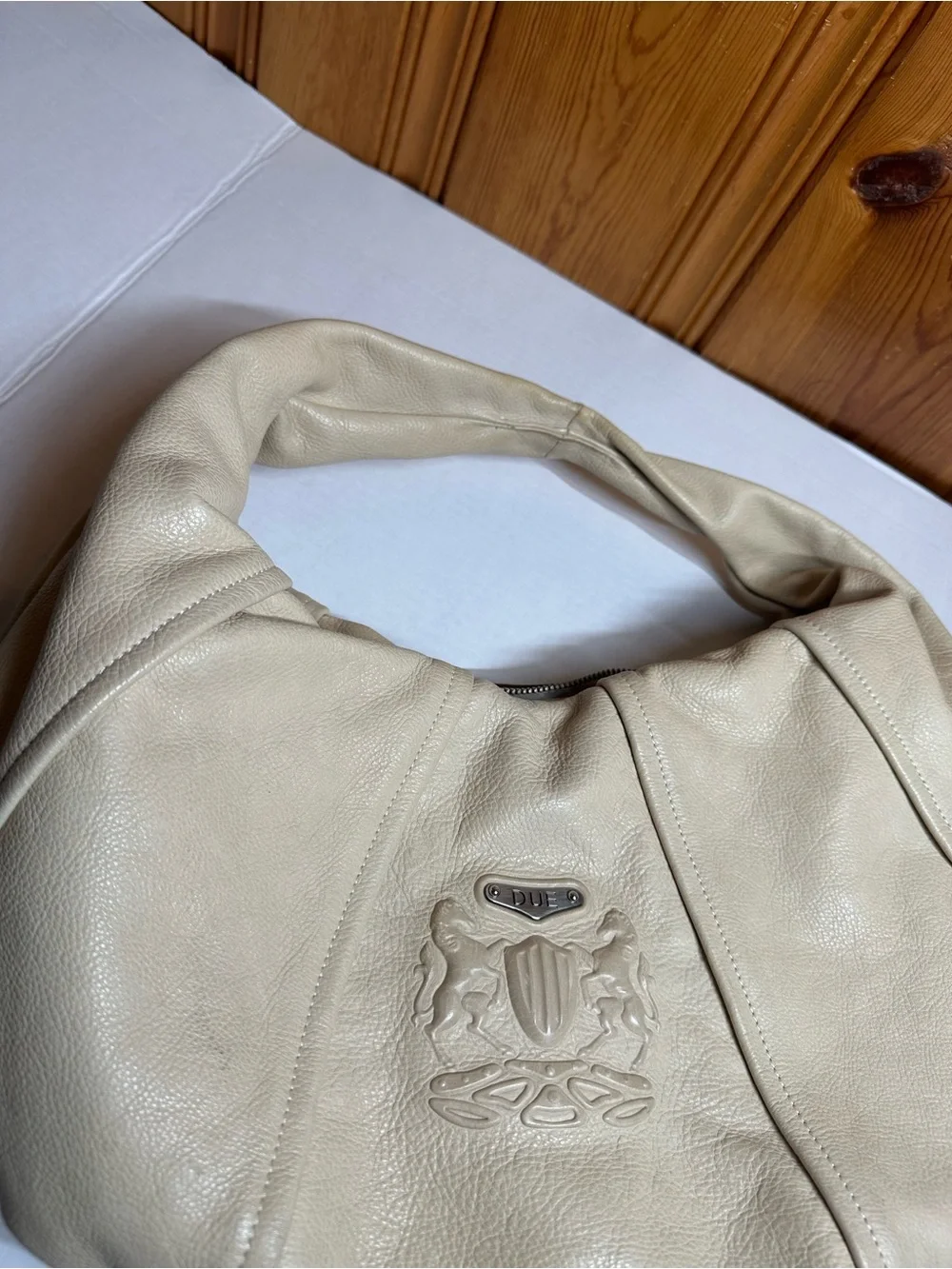 Cream Leather Shoulder Hobo Bag with Embossed Crest
